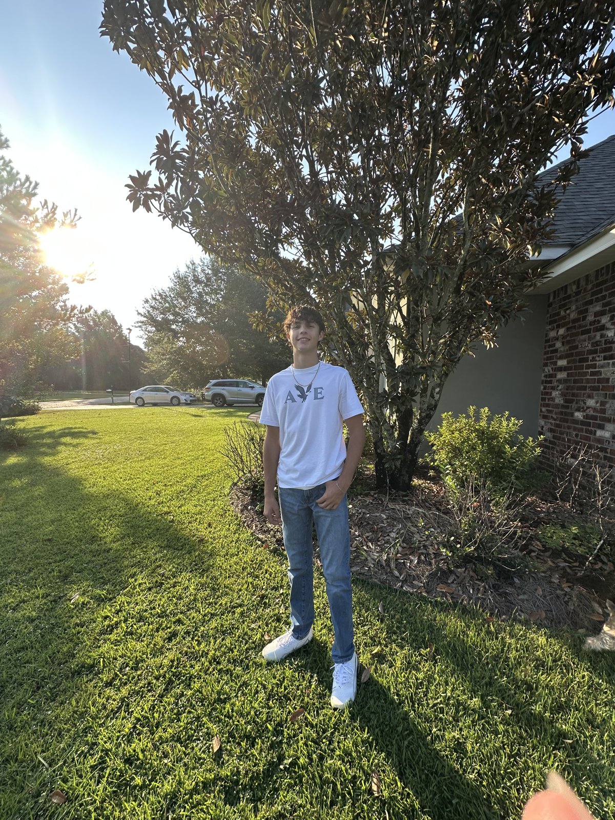 Josiah, owner of Pro Edge, standing on a freshly cut lawn